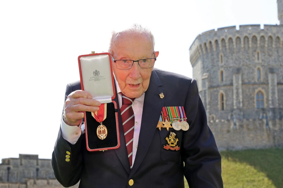 the queen confers the honour of knighthood on captain sir thomas moore