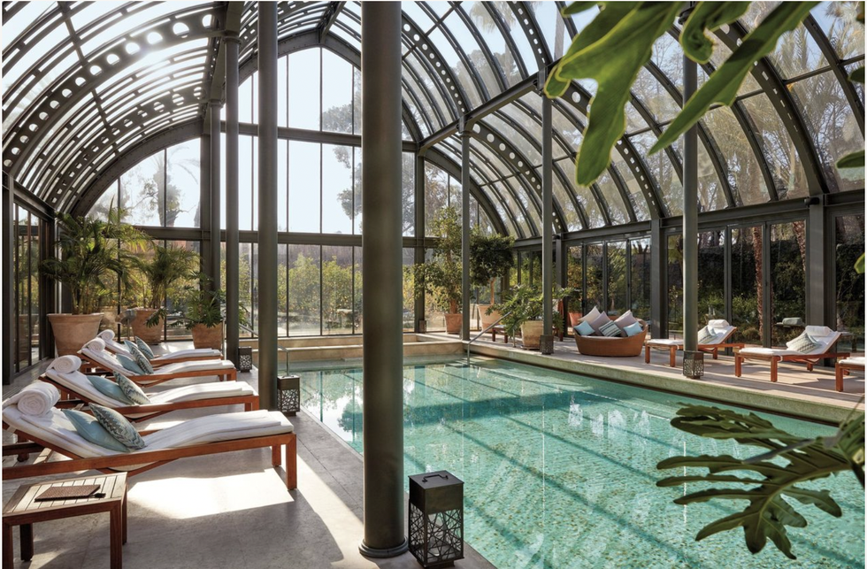 a swimming pool with a large glass ceiling