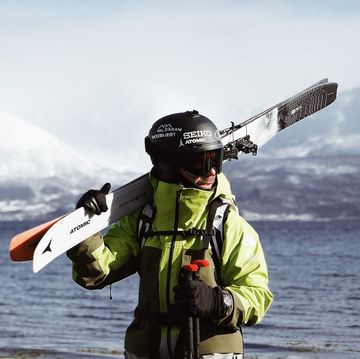 a man holding a ski