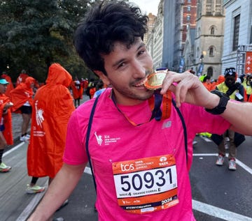 runner celebrating postmarathon with a medal