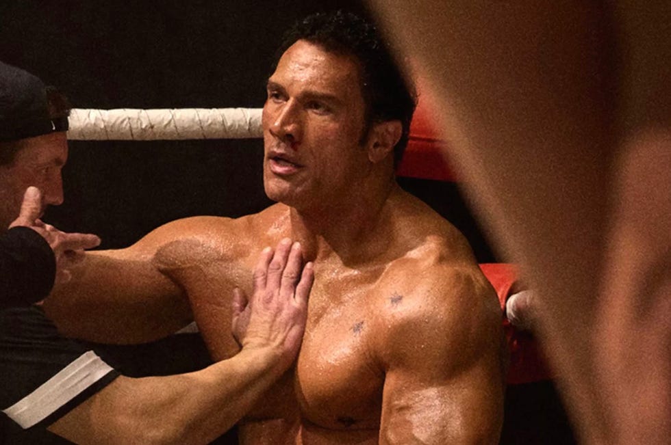 Closeup of a Bodybuilder in a competitive setting presiding assistance