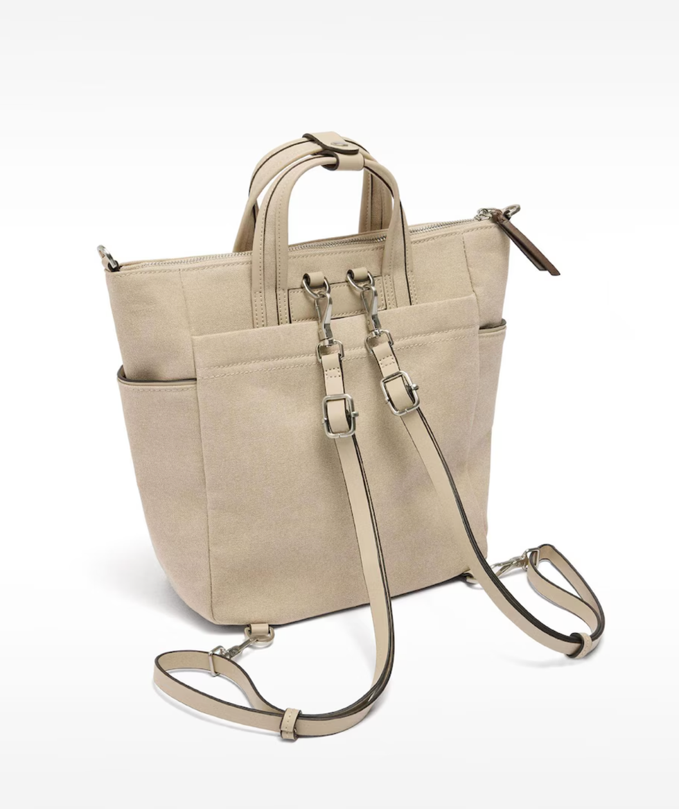 versatile beige handbag with both handles and adjustable straps