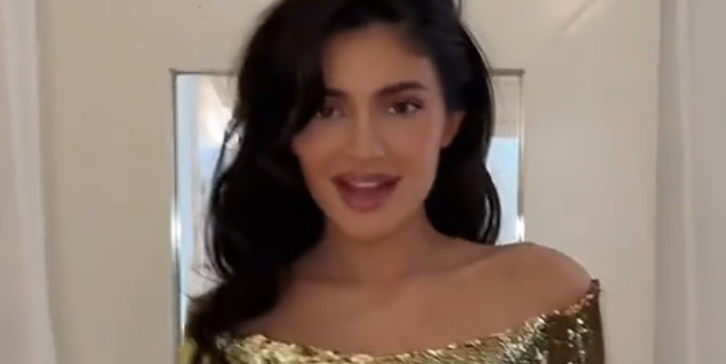 Kylie Jenner Wears Gold Column Gown to 2023 Christmas Eve Party