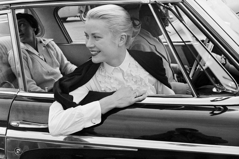 grace kelly during the cannes festival, 1955 she is wearing a trinity ring