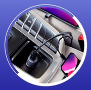 car charger in console charging iphone