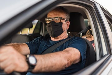 car driver wearing protective mask