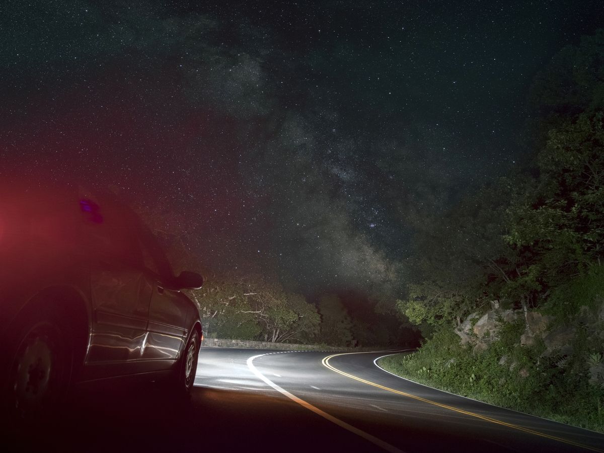 https://hips.hearstapps.com/hmg-prod/images/car-on-winding-road-under-starry-sky-royalty-free-image-672163763-1538065657.jpg?crop=0.88981xw:1xh;center,top&resize=1200:*