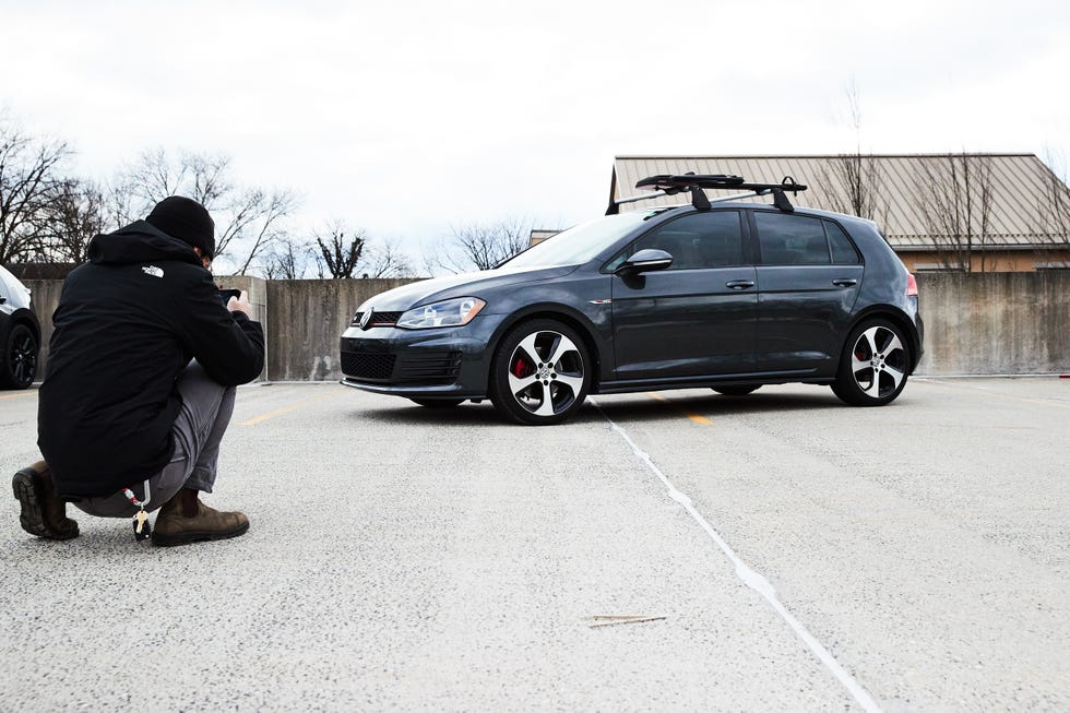 photographing volkswagen golf gti in parking lot