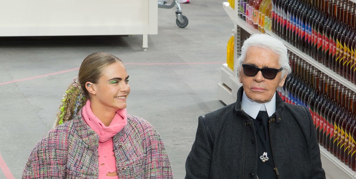 Cara Delevingne puckers up with Karl Lagerfeld as she joins
