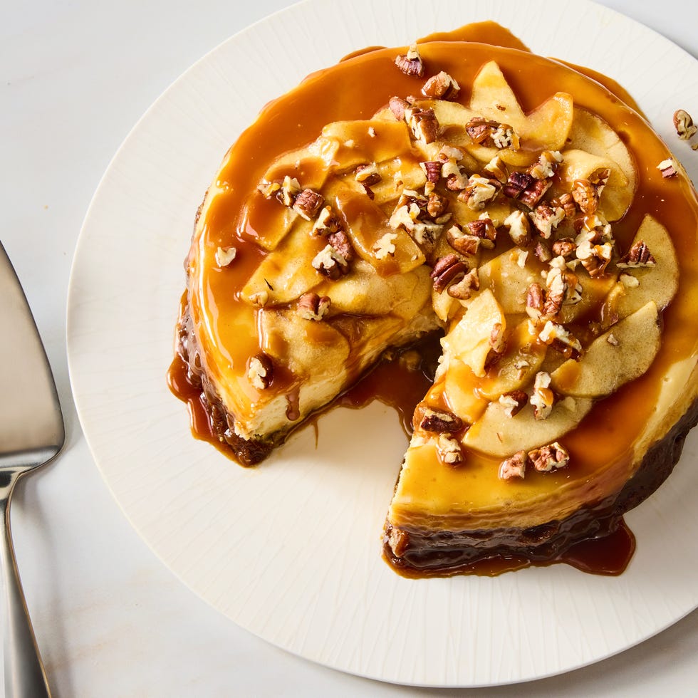 cheesecake with a caramel apple topping and crushed pecans