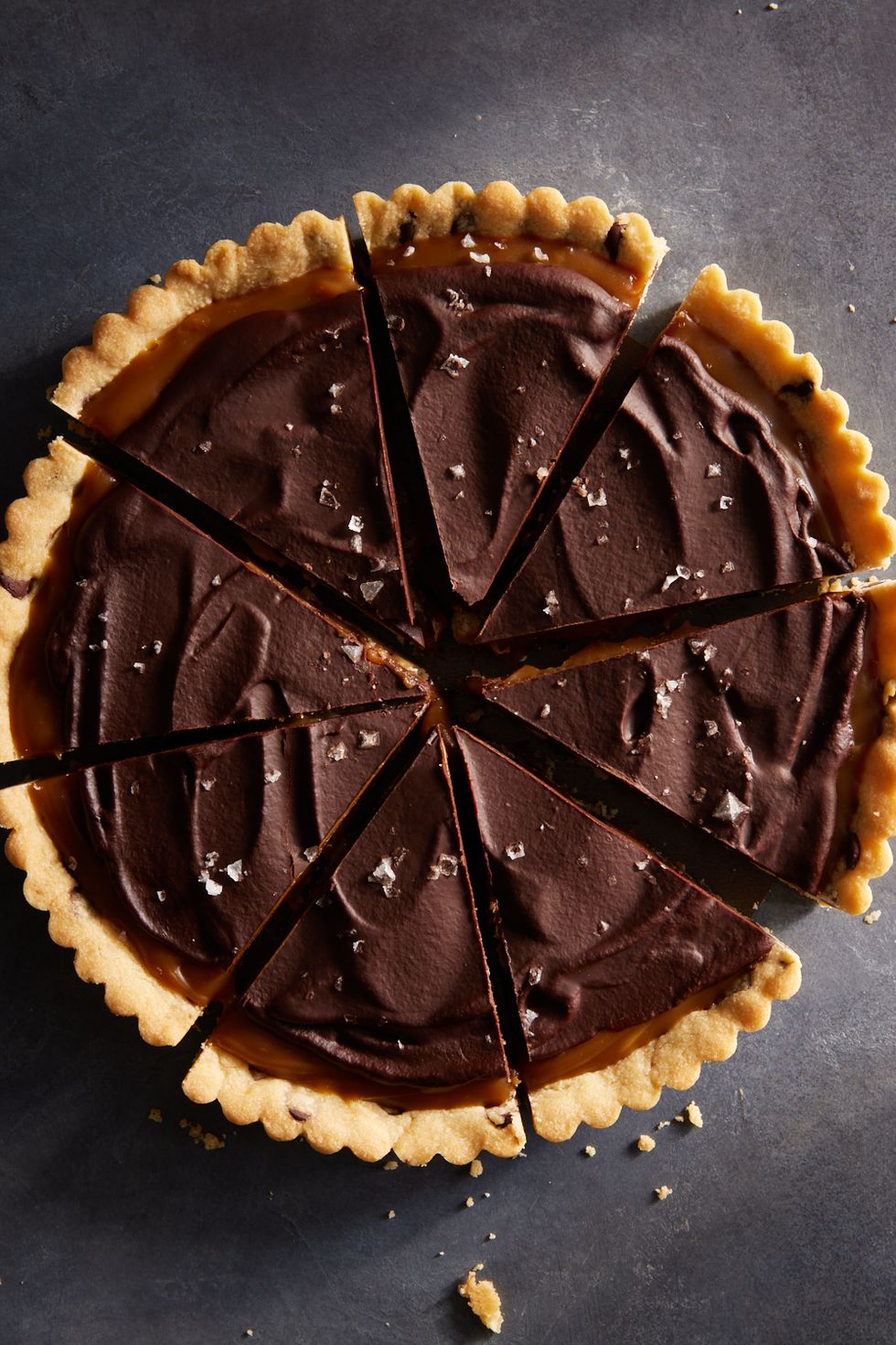 tart with chocolate chip cookie crust, filled with caramel and topped with chocolate ganache