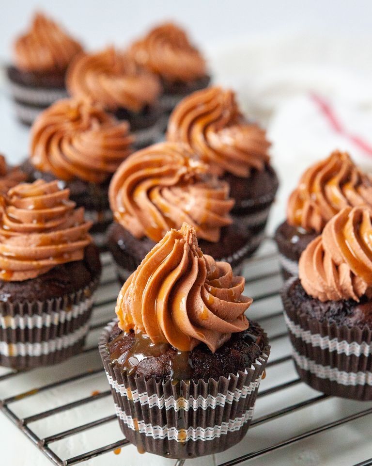 caramel macchiato cupcakes with chocolate frosting on wire rack