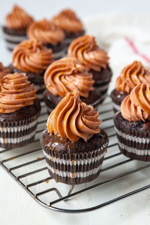 caramel macchiato cupcakes with chocolate frosting on wire rack