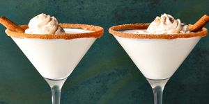 caramel snickerdoodle martini with a caramel rim, whipped cream and cinnamon