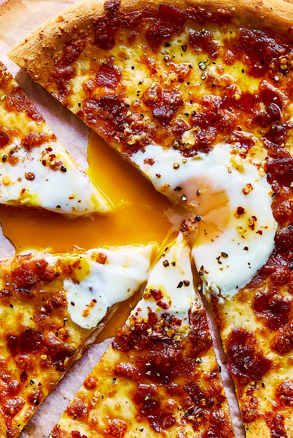 Carbonara Pizza pizza with an egg baked in the middle