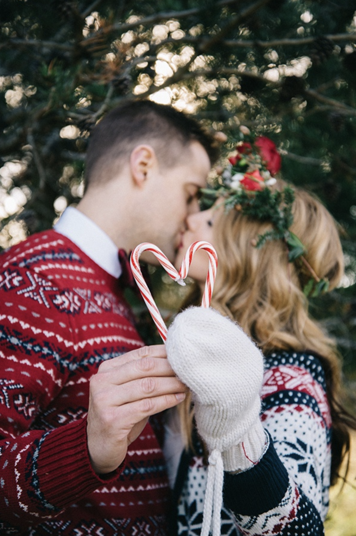 Lovely happy young couple poses before a red Christmas tree in a cosy  corner Stock Photo | Adobe Stock