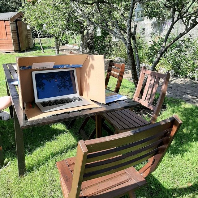 cardboard box with laptop inside outdoors