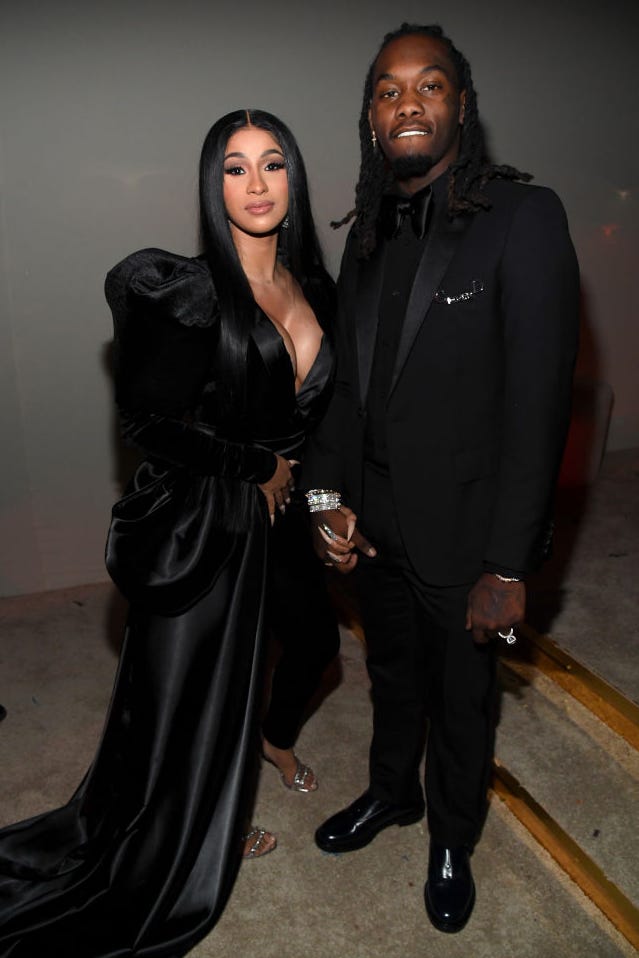 Cardi B and Offset in December 2019 cardi b and offset stand together and hold hands as they pose for a photo, both wear all black
