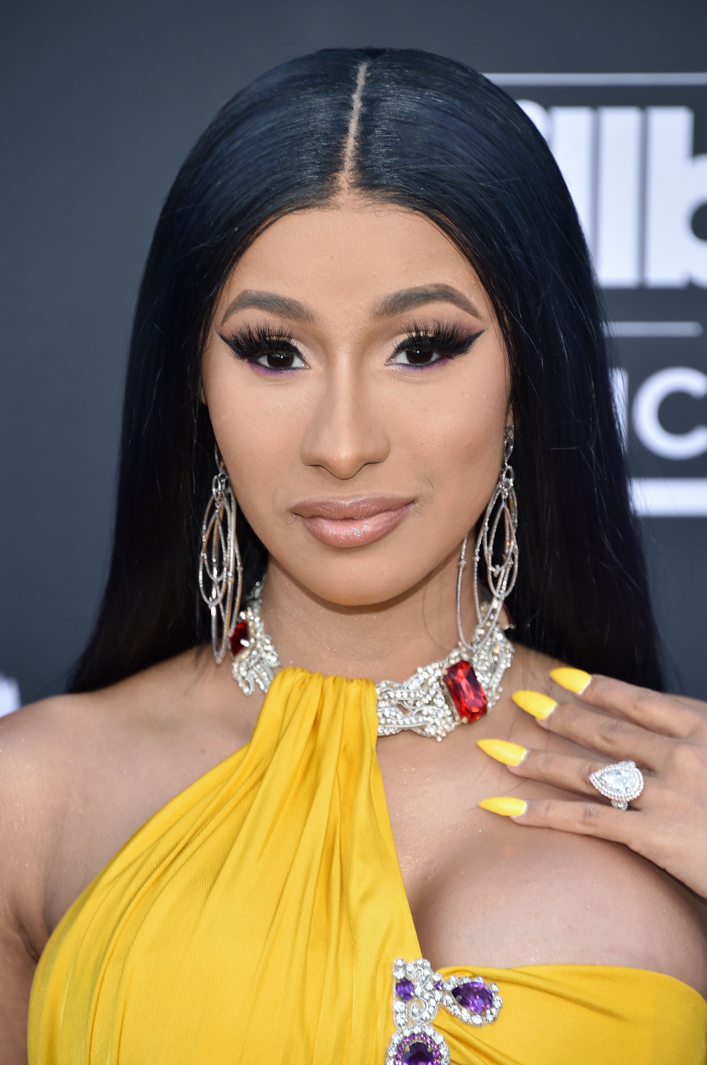 Cardi B tries new pink and blue pixie crop wigs on lockdown