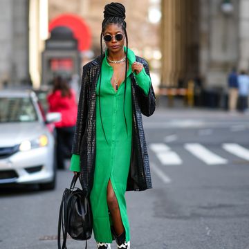 woman wearing green dress and leather jacket