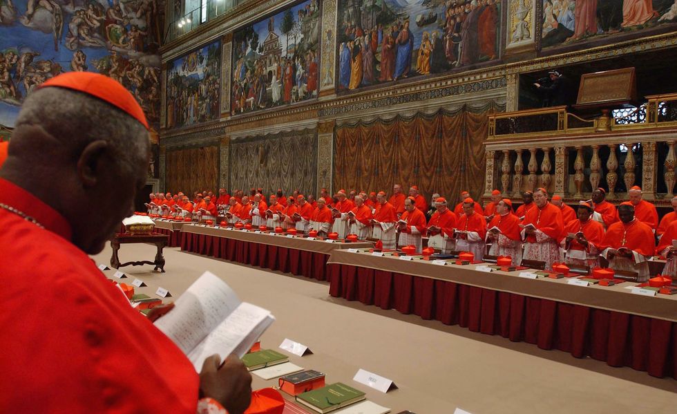 cardinals begin deliberations for a new pope