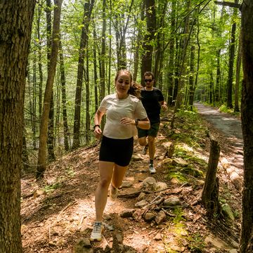 pavlina and john running trolli on a trail in jacobsburg park 2023