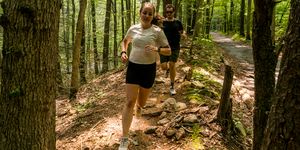 pavlina and john running on a trail in jacobsburg park 2023