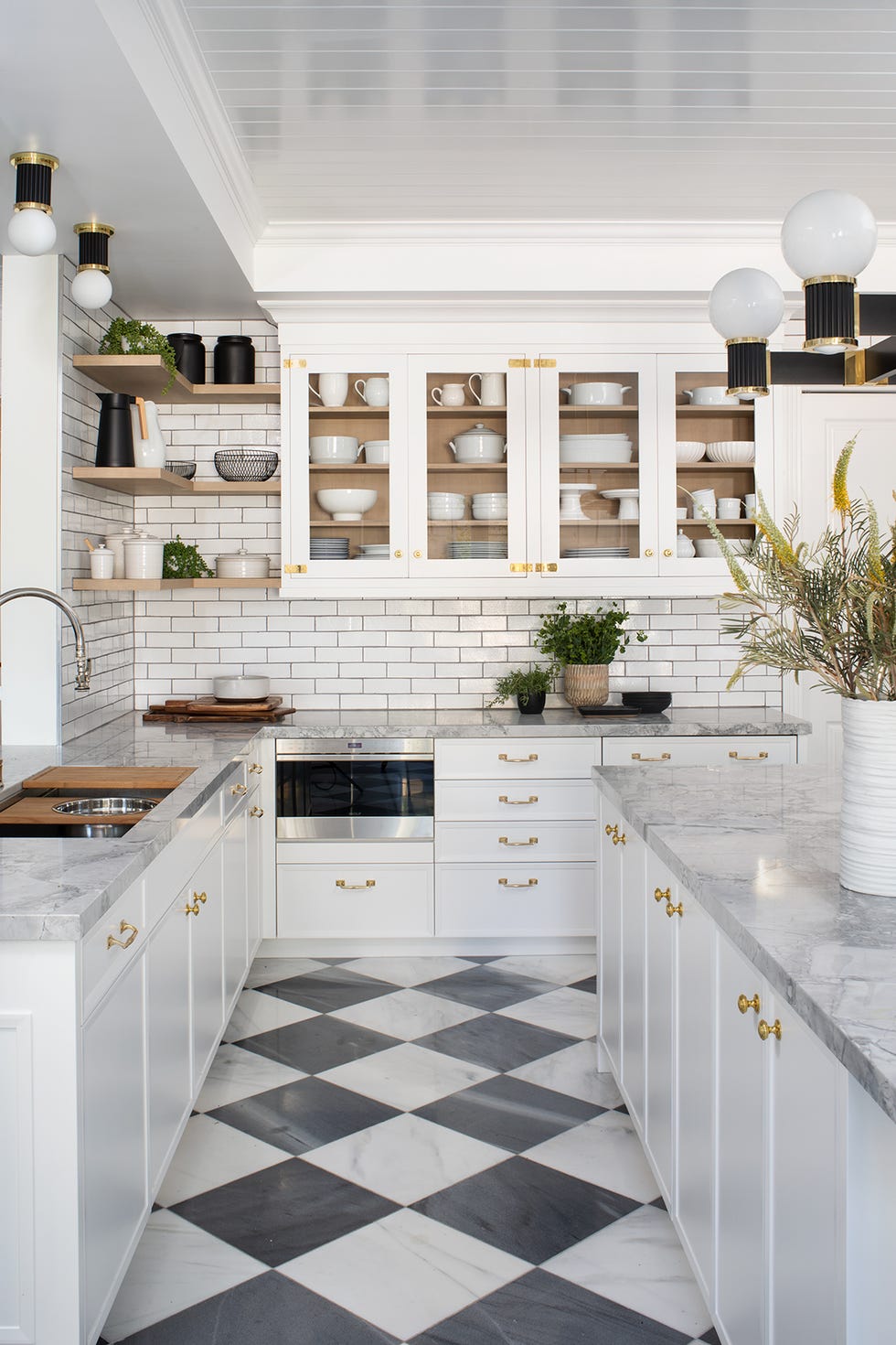Kitchen with white cabinets and checkerboard floors
