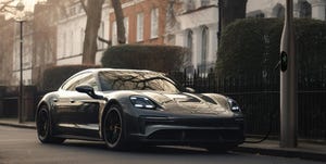 a black sports car parked on the side of a street