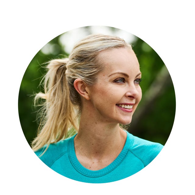 portrait of a woman with a ponytail wearing a turquoise sweater
