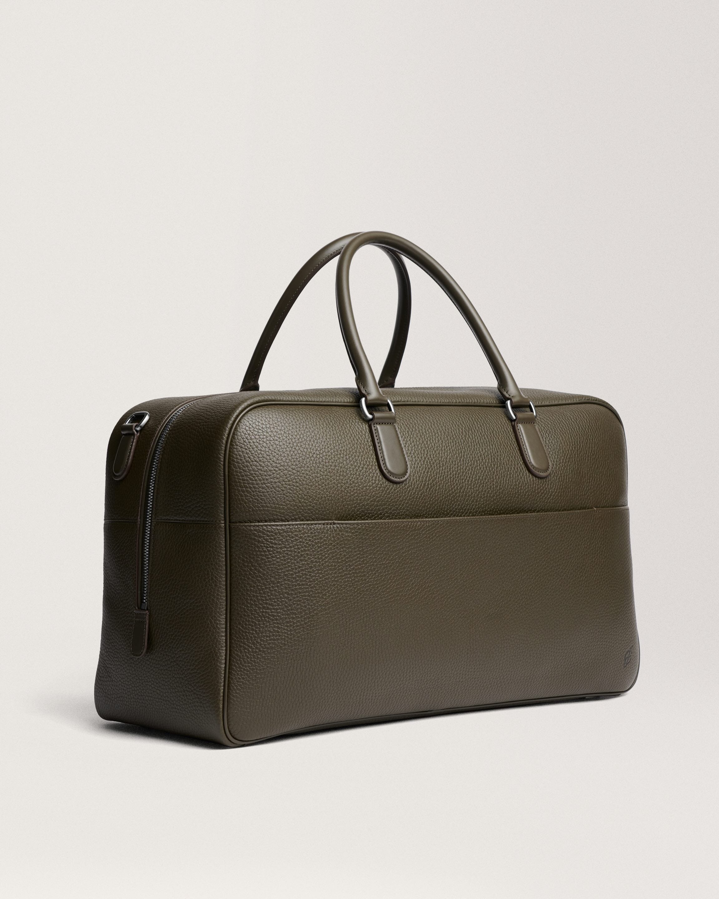 an olive green luggage bag