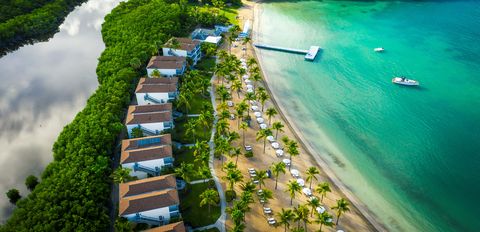 the beach terrace suites at carlisle bay antigua, a good housekeeping pick for best all inclusive family resorts, have rainforest on one side and the ocean on the other