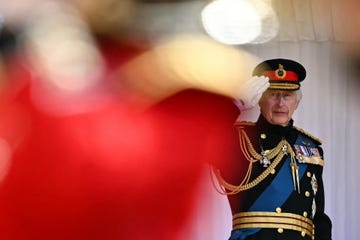 king charles iii, colonel in chief of the household division, presents new colours to no 9 and no 12 company of the irish guards, during a ceremony at windsor castle, berkshir