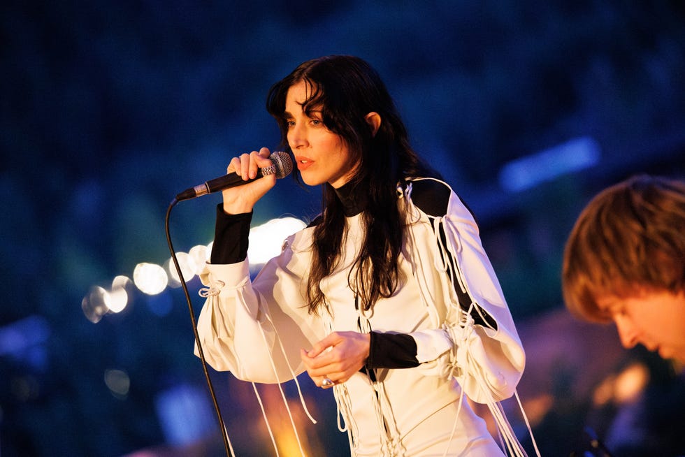 woman singing into microphone