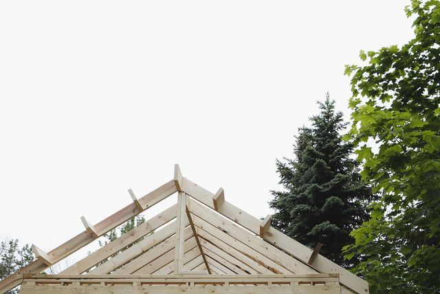 Carpenter framing a cabin