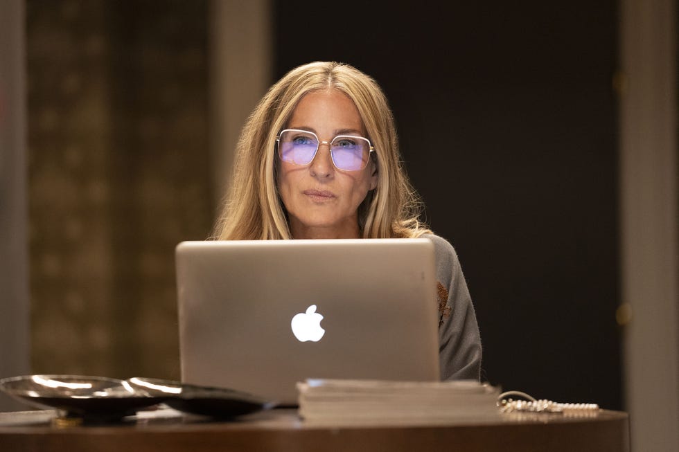 and just like that carrie working from home on laptop