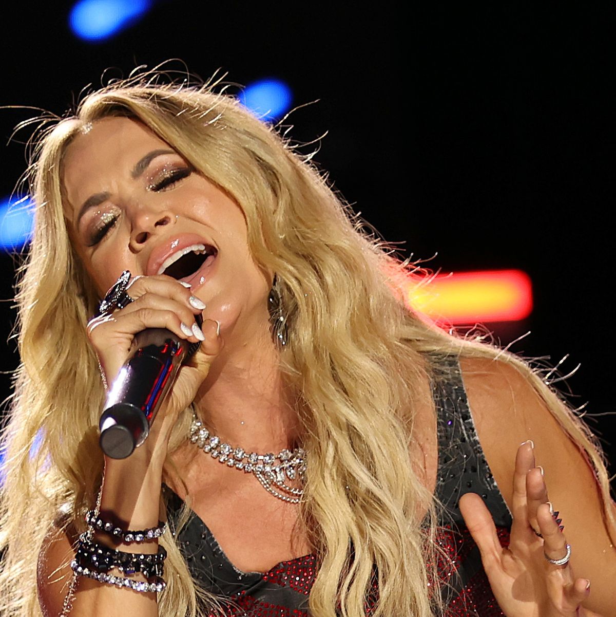 Carrie Underwood Shows Off 'Ripped Legs' in Denim Romper in New