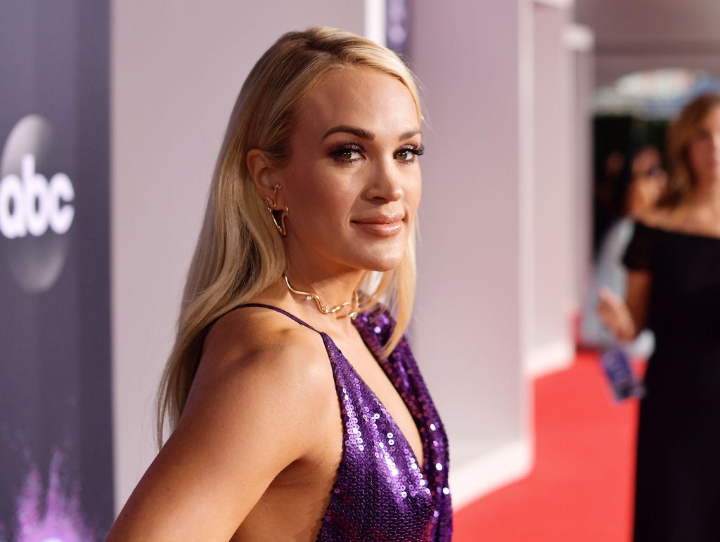 Carrie Underwood signs a bra for a Brest Cancer charity in the, WireImage