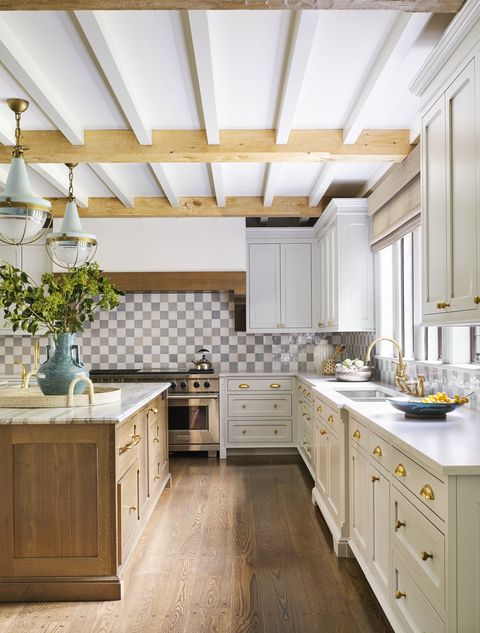 the kitchen’s chic checkerboard backsplash is fashioned out of glazed terra cotta tile