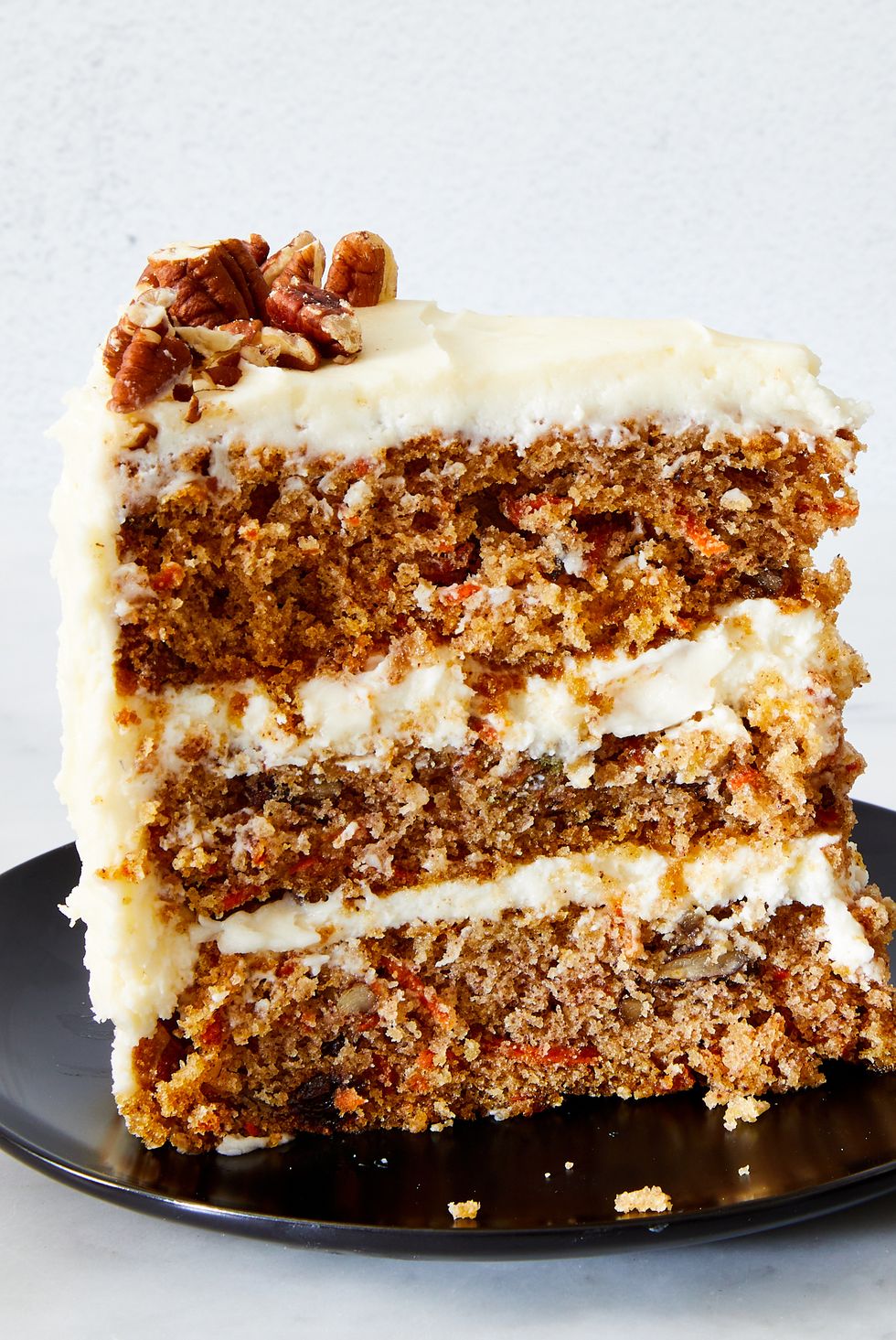 carrot cake with cream cheese icing and pecans