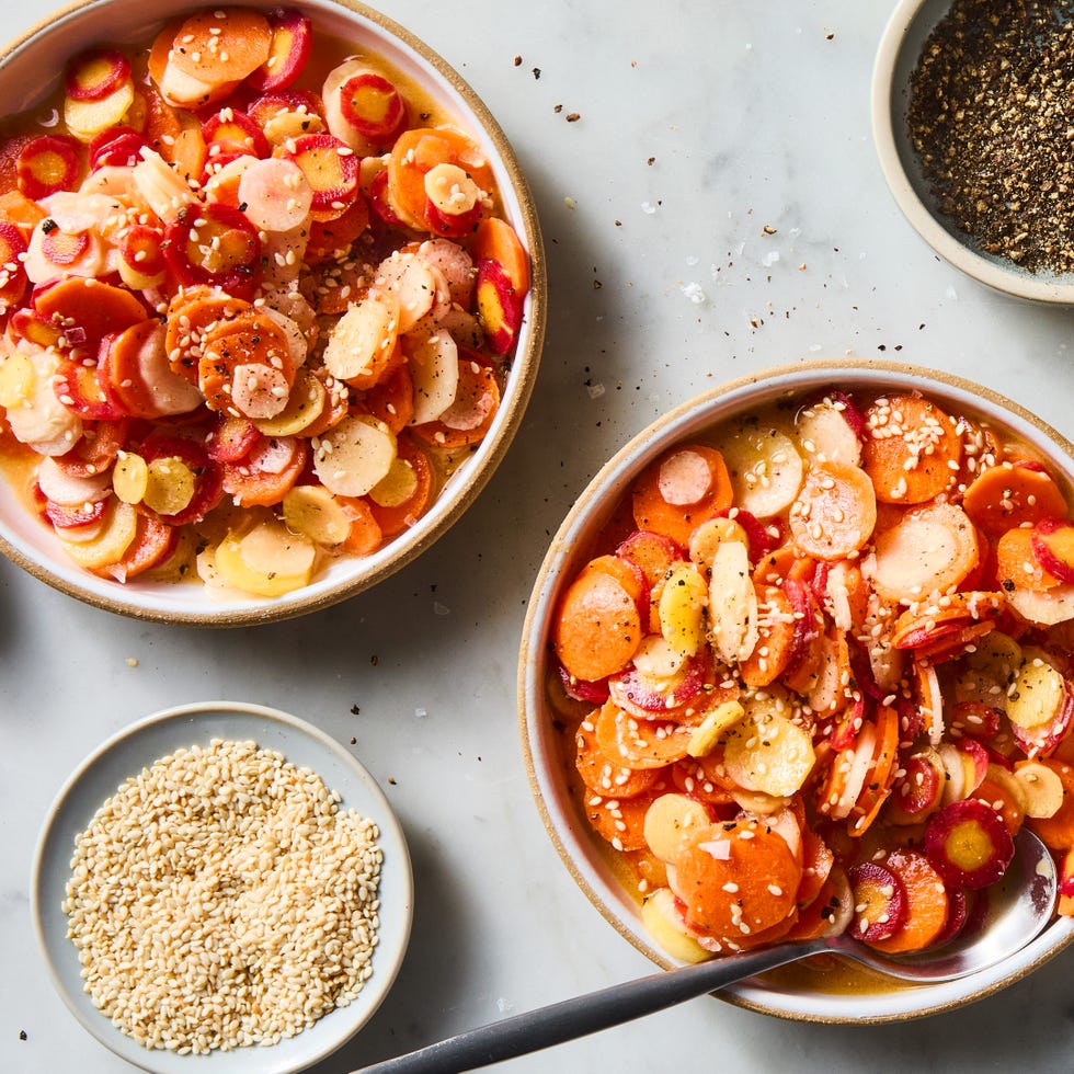 carrot coins tossed in a salad