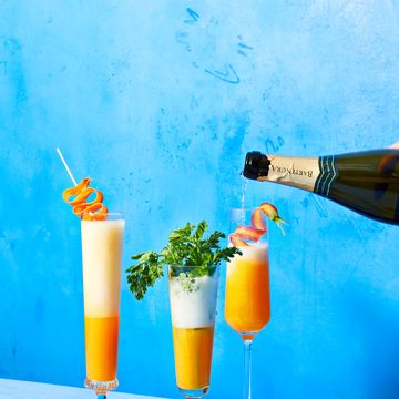 three glasses carrot mimosas with garnish