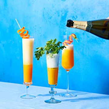 three glasses carrot mimosas with garnish