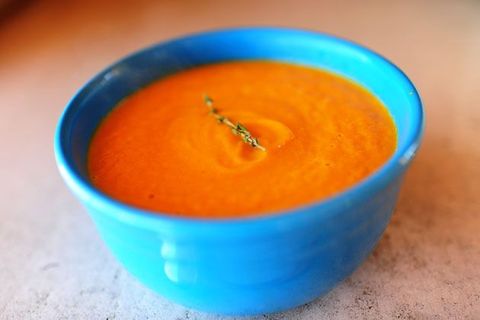 carrot thyme soup in blue bowl