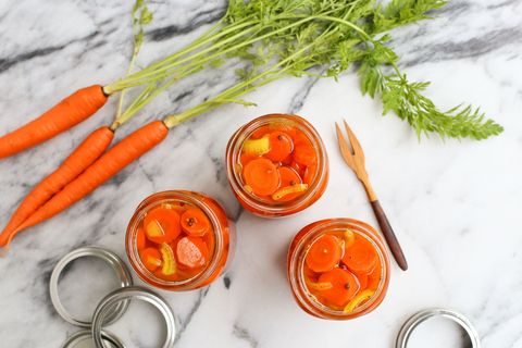 quick pickled carrots in jars on marble