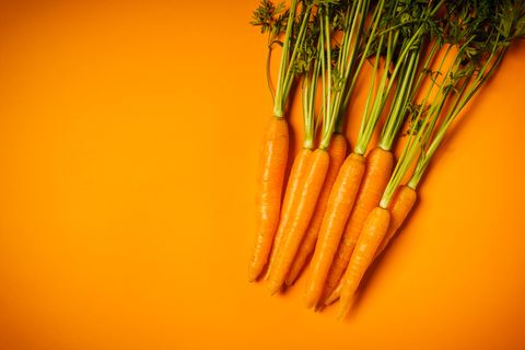 carrots over orange background
