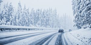 cars driving on snowy remote road