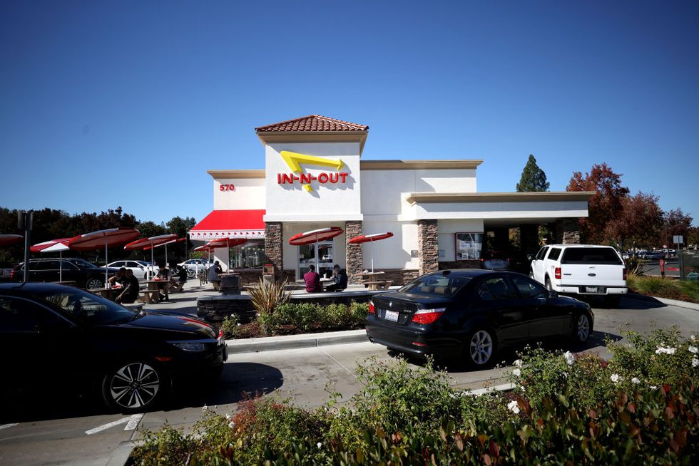in n out burger clashes with local governments over vaccine verification mandates