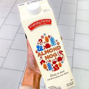 carton of almond nog in someone's hand