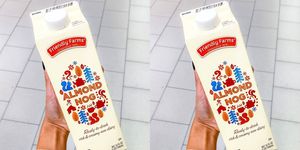 carton of almond nog in someone's hand